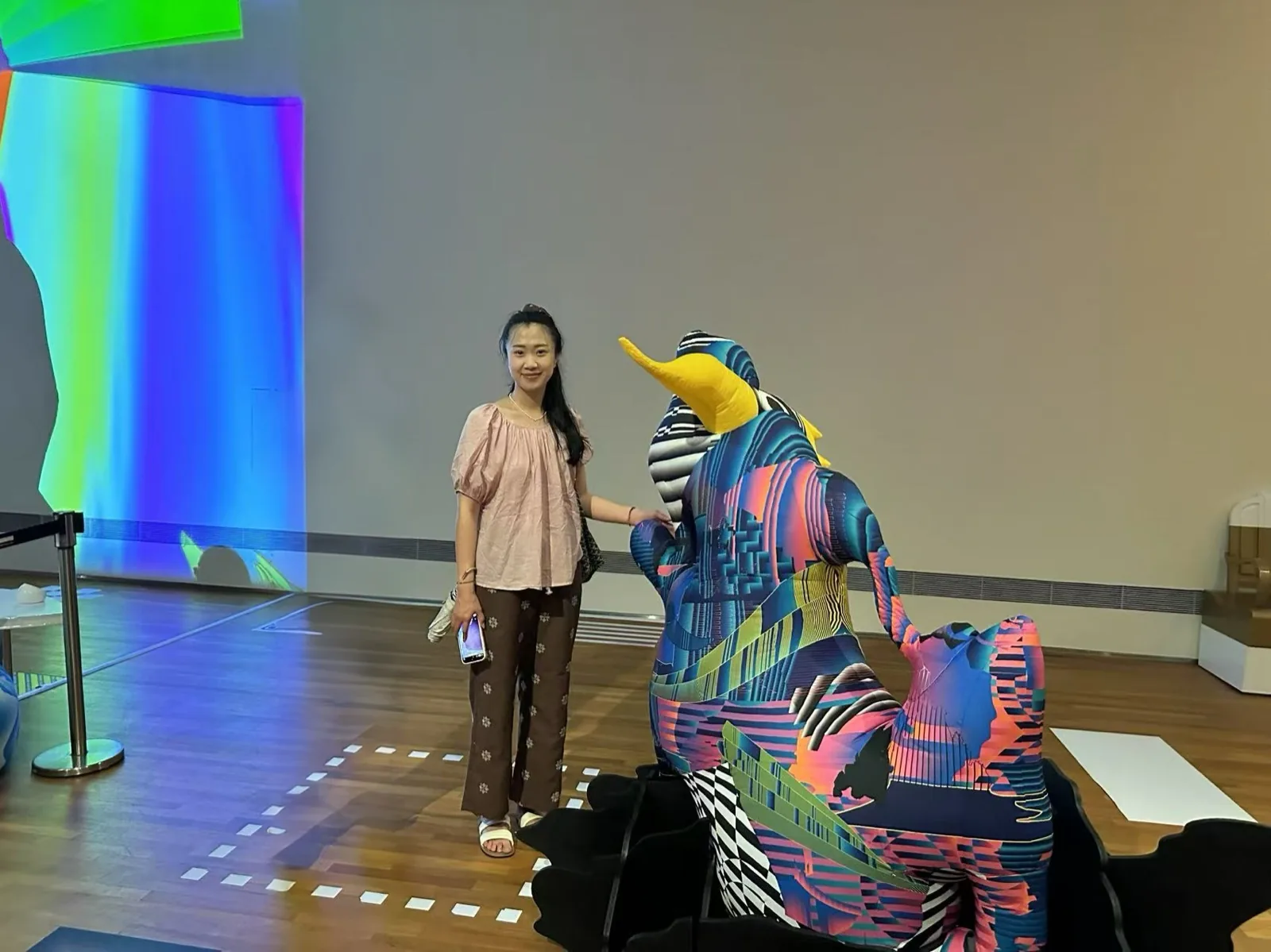 Sandy Wang visiting a design exhibition